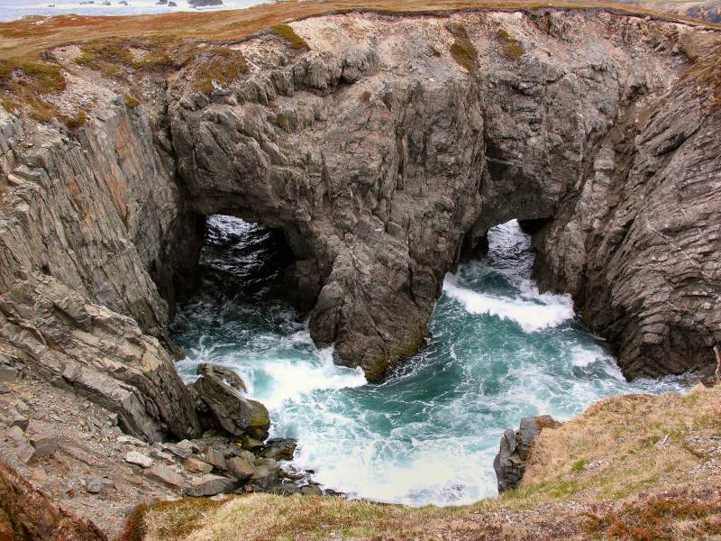 AroundNL-22 The Dungeon. A double entrance sea cave whose roof has caved in.