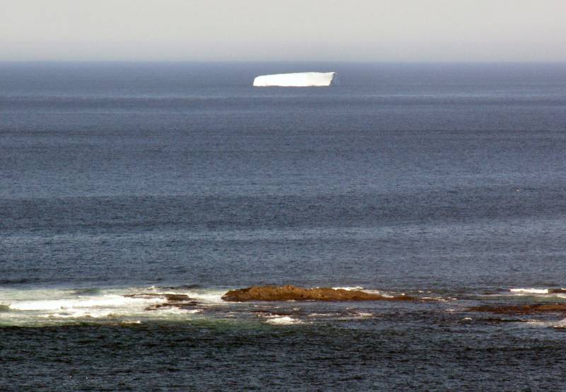 AroundNL-39 A tabular iceberg several miles off the coast of L'anse aux Meadows