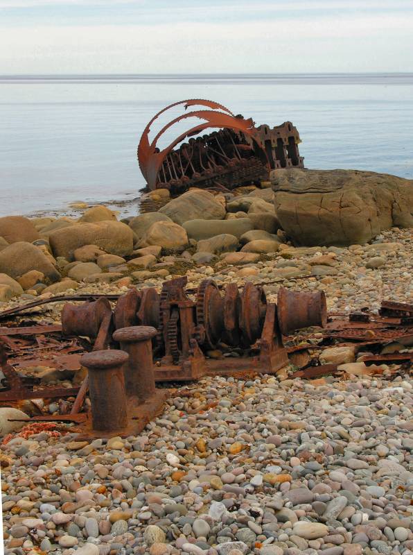 AroundNL-47 The SS. Ethie ran ashore in December of 1919. Parts of her boiler, engine, windlass and deck fittings remain.