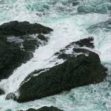 AroundNL-25 The sea foams on the rocks 300 feet below the Long Point lighthouse in Twillingate