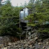 h0 A precariously perched outhouse.